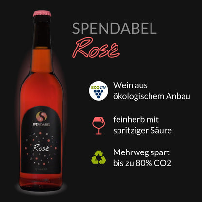 SPENDABEL Rosé Roséwein aus ökologischem Anbau trocken 2021 in einer 0,5 Liter Bierflasche auf schwarzem Hintergrund